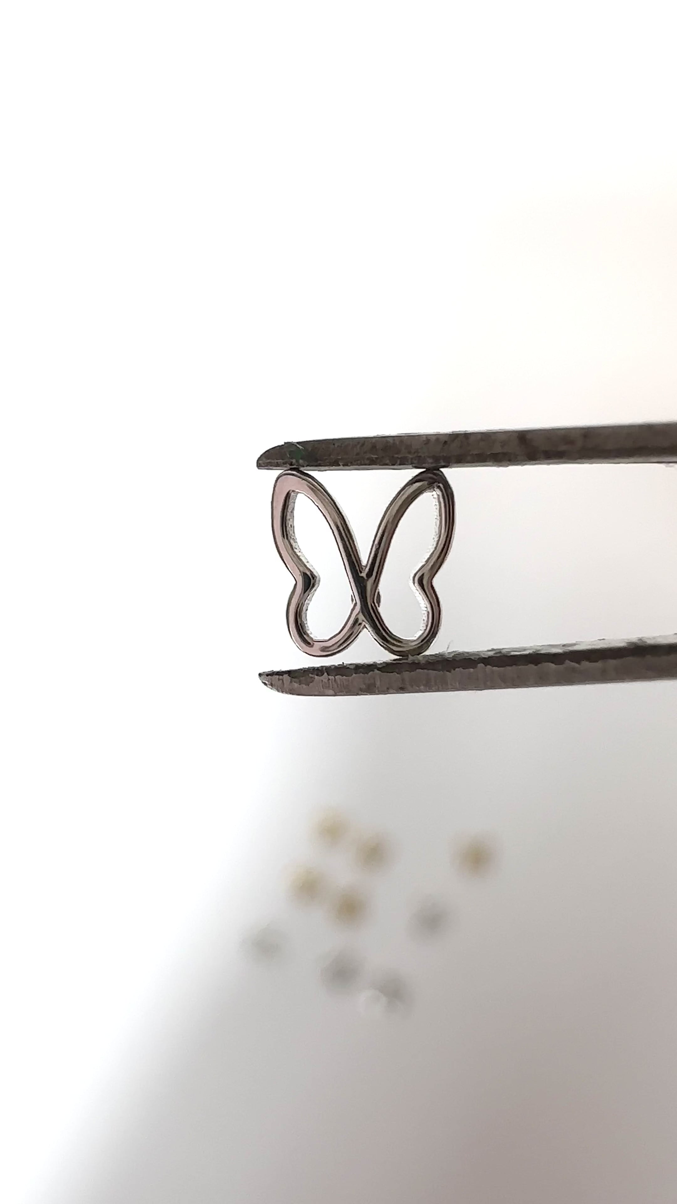 Hollow Butterfly Tooth Charm